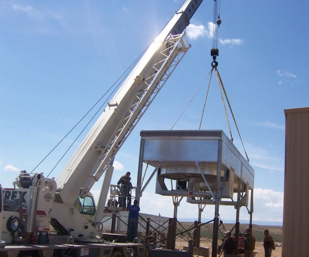Crane installing industrial fans