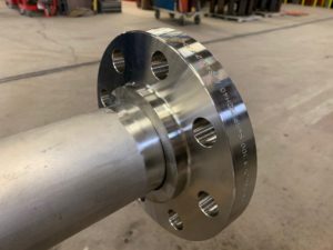 Cleaning a processing pipe and placing flange